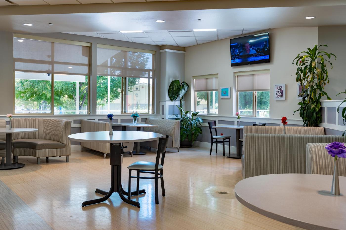 Photo of dining room, closer to bright windows