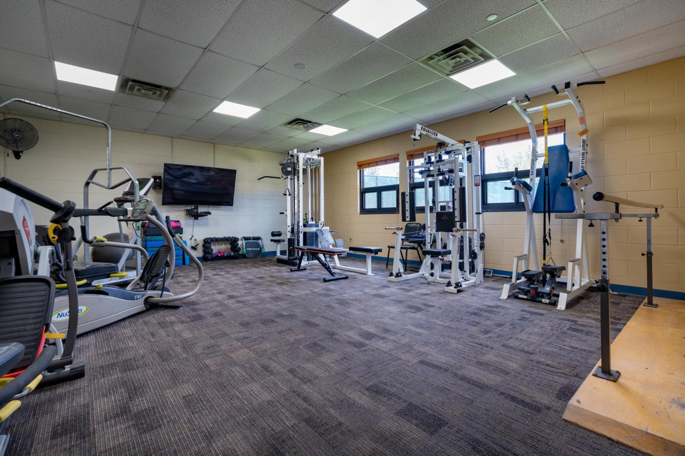 Exercise room with lifting equipment